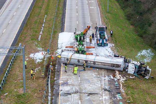 Tanker carrying 7,500 gallons of gas overturns after interstate crash